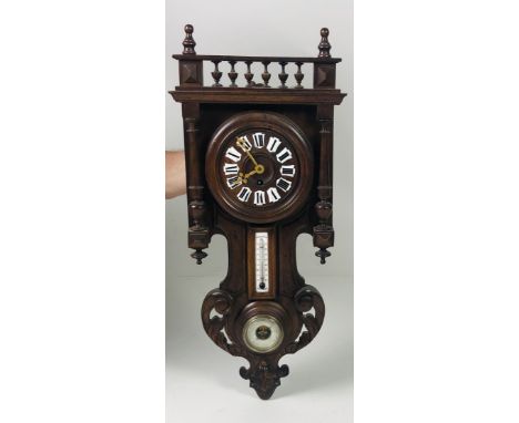 A shaped walnut Wall Clock, of small proportions with barometer and thermometer. (1)