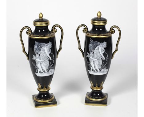 An attractive pair of 19th Century tall two handled French porcelain Vases, with lids, each with gilt high-light blackened bo