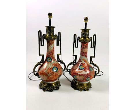 A pair of attractive Chinese porcelain and ormolu mounted Table Lamps, decorated with dragons and leaf scroll, approx. 56cms 