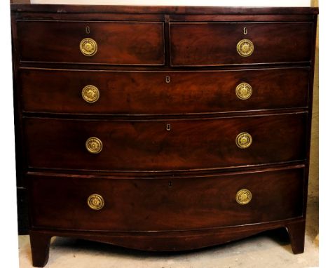 An early 19th Century inlaid mahogany bow fronted Chest, with banded top over two short and three long drawers with brass rin