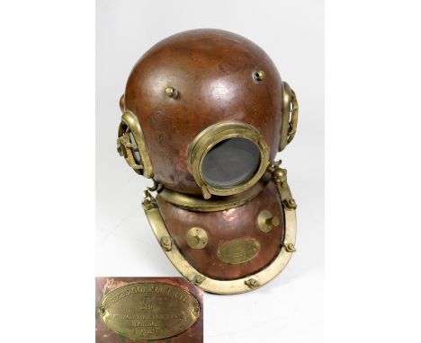 A 12 bolt Diving Helmet, by Siebe Gorman & Co. London, the copper bonnet with oval side windows and guards, the circular fron