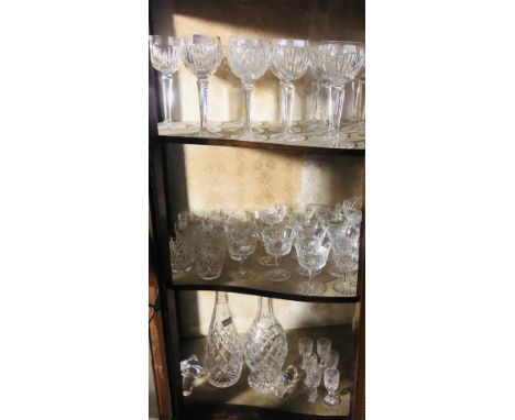 A collection of varied "Waterford" Drinking Glasses, including goblets, sherry, brandies, decanters and a large glass Lamp, a