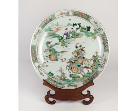 A 19th Century Famille Verte Kangxi type large Plate or Dish, painted with mounted warriors in a rocky landscape, approx. 36c