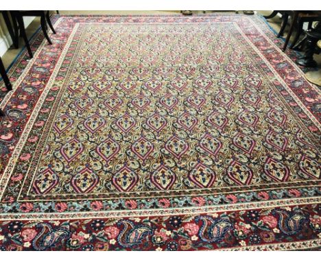 An attractive and large 19th Century purple ground Middle Eastern floral Carpet, the centre with multiple foliate design and 