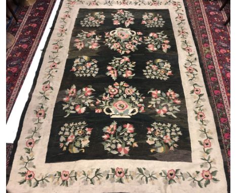 An attractive late 19th Century / early 20th Century Aubusson type Carpet, the dark green ground with 15 floral bouquets insi