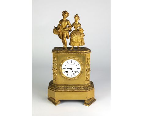 A fine 19th Century French ormolu Mantle Clock, by Thomas et Higginbotham, Paris, the top surmounted with figures of a gentle