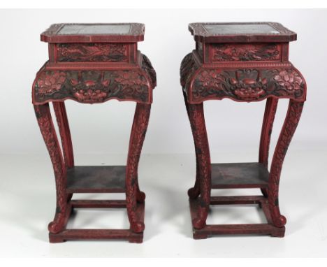 A pair of attractive large late 19th Century Chinese cinnabar Stands, with profuse decoration of dragons and flowers on a pla