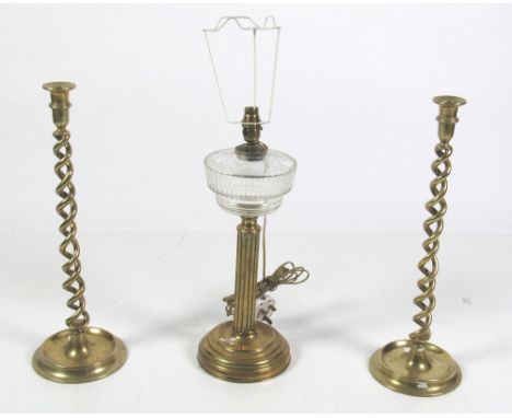 A pair of 19th Century tall brass barley twist Candlesticks, together with a brass Oil Lamp converted, with reeded pillar sup