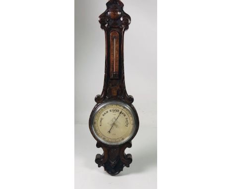 A carved oak Banjo Barometer / Thermometer, signed A. Franks. (1)