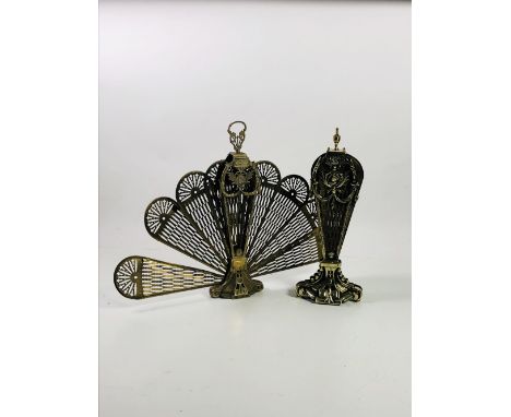 An attractive heavy brass Peacock Fan Firescreen, and a smaller similar ditto, dam. (2)
