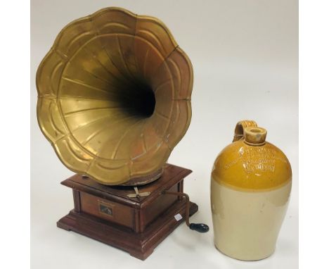 A small reproduction Table Gramahpone with brass horn speaker; an old glazed earthenware Whisky Jar inscribed, 'P. Lawler, Gr