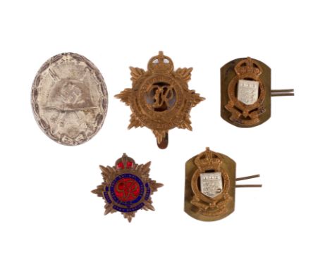 Five assorted WWII and later badges. Comprising two George VI Royal Army Service Corps badges, one of which is enamelled, two