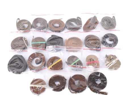 A box of assorted military leather and canvas straps. Including German Dienstglas button straps, British WWII binocular canva