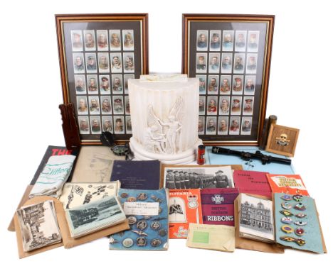 A group of military books, cigarette card, postcards, and other military related items. The books including 'Manual of Artill