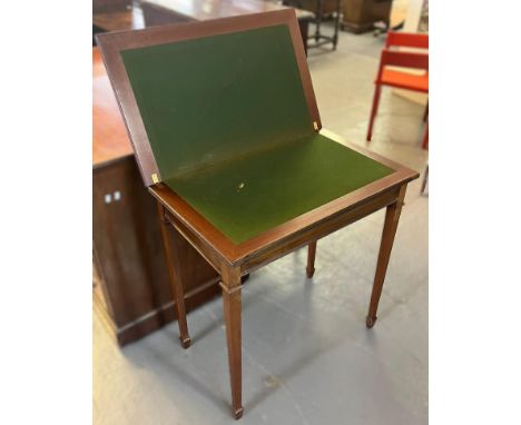 Edwardian mahogany rectangular shaped fold over card table on square legs with spade feet. 70cm wide approx. (B.P. 21% + VAT)