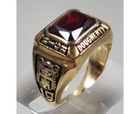 10K gold Jostens Brand American college ring for Cardinal Dougherty High School and dated 1984, inset with red gem stone. 9.5
