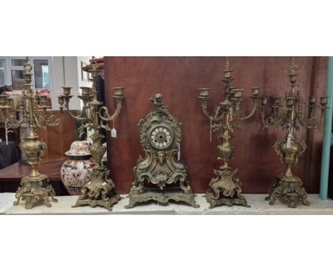 20th century French brass figural and dolphin mounted mantle clock case together with two similar pairs of five branch candel