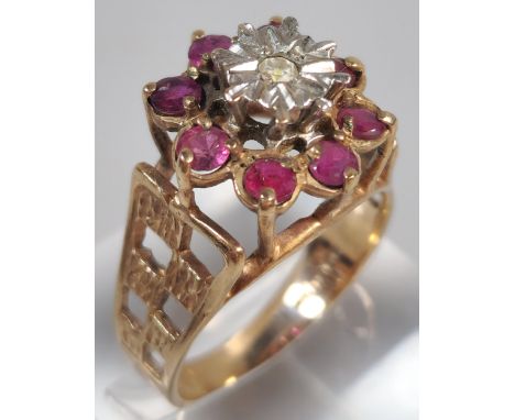 9ct gold ruby and diamond flowerhead cluster ring. 4.7g approx. Size O. (B.P. 21% + VAT)