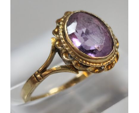 9ct gold and purple stone dress ring. 2.2g approx. Size M. (B.P. 21% + VAT)