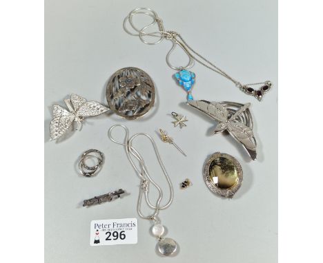 Collection of silver and white metal jewellery to include: blue enamel pendant on chain, Art Nouveau design brooches, butterf