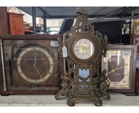 Group of three assorted mantle clocks, including: walnut cased three train mid central architectural clock, two train train r
