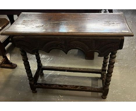 17th century oak side table on bobbin turned legs with later carved decoration. 93cm wide approx. (B.P. 21% + VAT)
