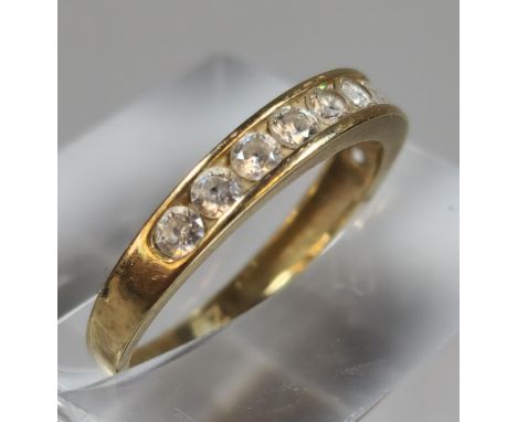 9ct gold and cubic zirconia half eternity style ring. 1.1g approx. Size J. (B.P. 21% + VAT)
