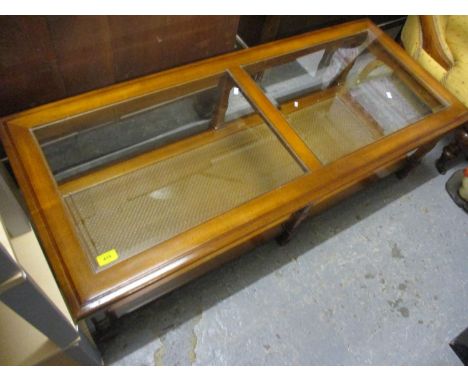 A modern two tier glass topped coffee table, together with a matching lamp table 