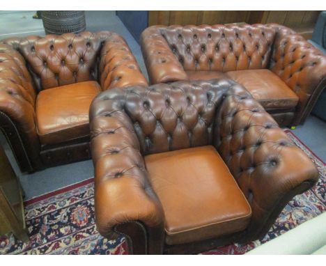 A button back Chesterfield two seater sofa, together with two matching armchairs 