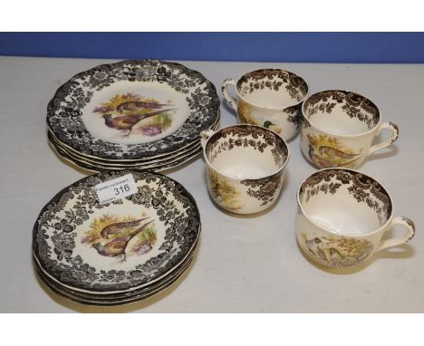 Four place setting Royal Worcester Group Paisley Games Series tea cup, saucer and side plate 