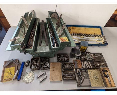 Mixed tools to include micrometers, drill bits, and other tools housed in a metal cantilever toolbox, socket wrench set, 1951