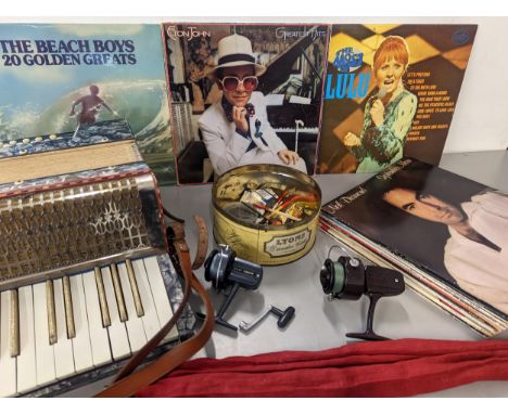 A mixed lot to include a selection of LPs, Elton John, Beach Boys and others, a boxed piano accordion, together with fish rel