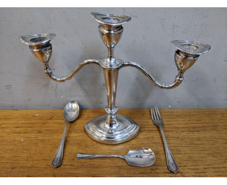 A silver three branch candelabrum together with a silver fork and two silver spoonsLocation: 