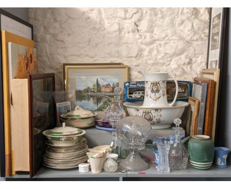 A large mixed lot to include wash jug and bowl, Waterford candlestick, mixed pictures, framed rowing display, Wedgwood and ot