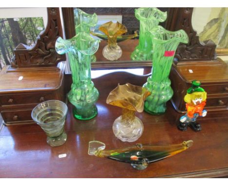 A selection of glassware to include a Whitefriars strap vase in sea green, Murano glass clown, and small gondola shaped bowl,