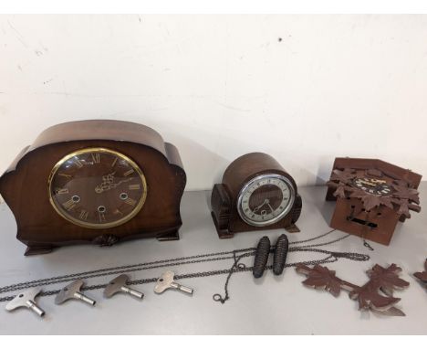 A Smiths mahogany cased mantel clock striking on four gongs, an Art Deco style example, and a cuckoo clock Location: 