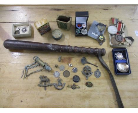 A selection of medal, coins, cap badges and other items to include George V special constabulary for faithful service named t