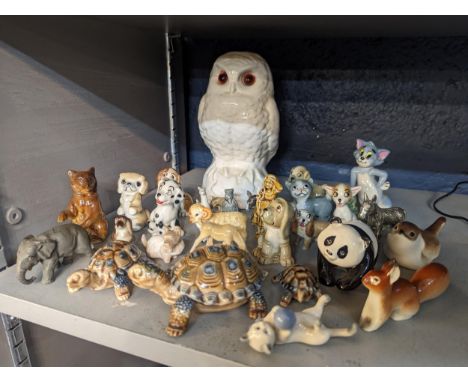 A group of ceramic and other model animals to include Beswick giant panda, USSR squirrel and others, Wade models and Tom from