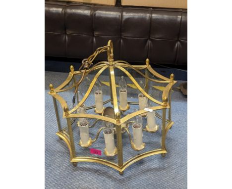 A vintage brass ceiling hanging lantern of octagonal form with curved glass panels, 42cm h x 46cm wLocation: 