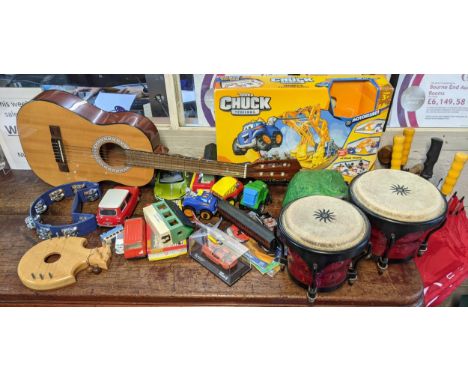 A mixed lot to include toys of musical instruments including a guitar, pair of bongos, Hornby 00 gauge and other itemsLocatio