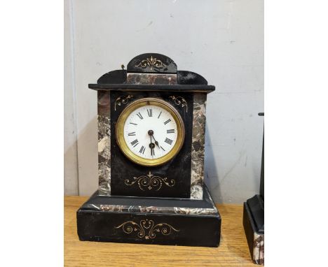 A black slate and marble cased mantel clock with an enamelled dial on a French movementLocation: 