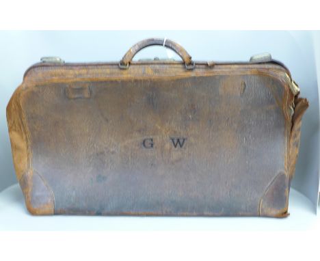 A large leather Gladstone bag marked W.E. Jackson, Drury Hill, Nottingham 
