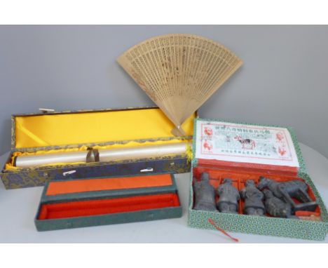 A Chinese scroll, fan and Terracotta Army figures 