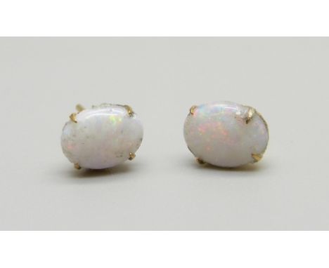 A pair of 9ct gold and opal ear studs, opals scratched, 0.8g 