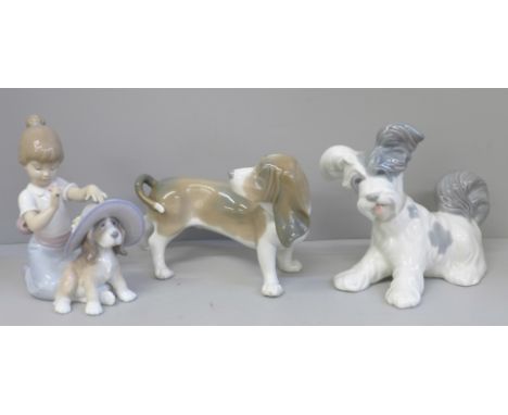 Two Lladro figures of dogs, one a/f and one figure of a girl playing with a dog 