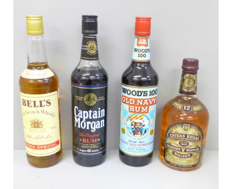 Four bottles of alcohol; Captain Morgan Original Rum, Woods 100 Old Navy Rum, Chivas Regal Scotch Whisky and Bell's Scotch Wh
