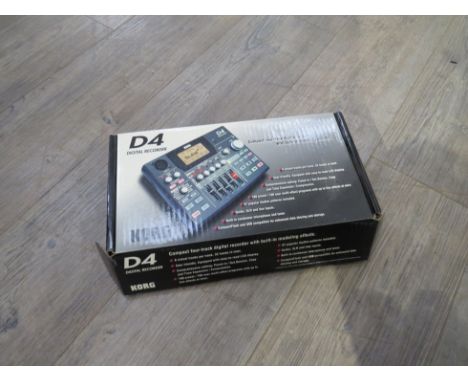 A Korg D4 digital recorder, boxed with instructions