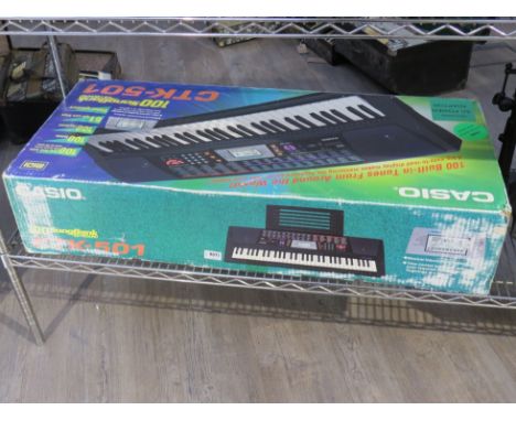 A Casio CTK-501 keyboard, boxed with accessories 