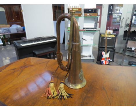 A copper bugle with applied military Argyll &amp; Sutherland badge