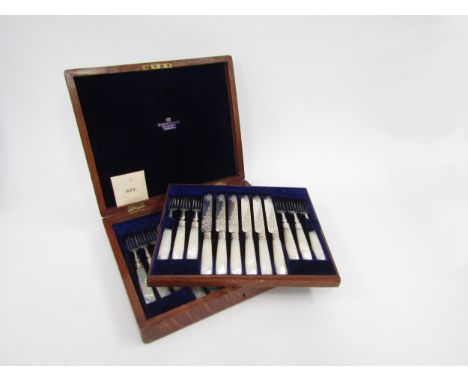 A Martin, Hall and Co set of twelve silver and Mother-of pearl handled fruit knives and forks, Sheffield 1891, in fitted cant